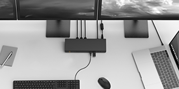 Using a tablet computer and laptop for daily work tasks.