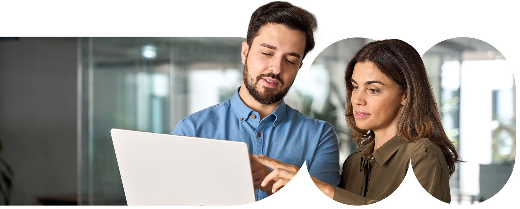 Two colleagues working on a laptop