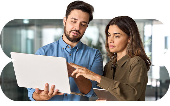 Two colleagues working on a laptop