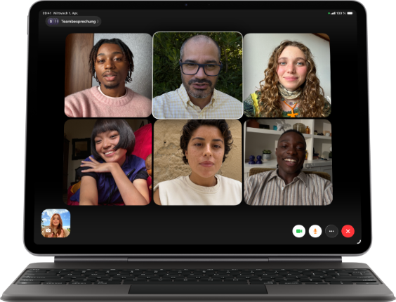 iPad Air, attached to Magic Keyboard, Black colour, Group FaceTime call on screen