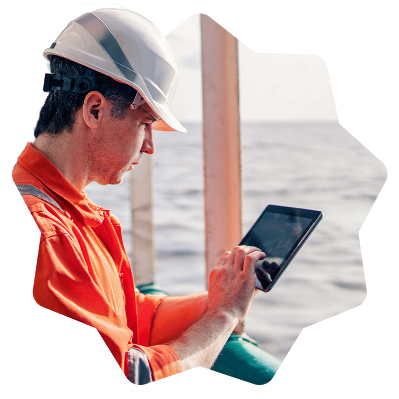 Maritime engineer monitoring a ship with a tablet
