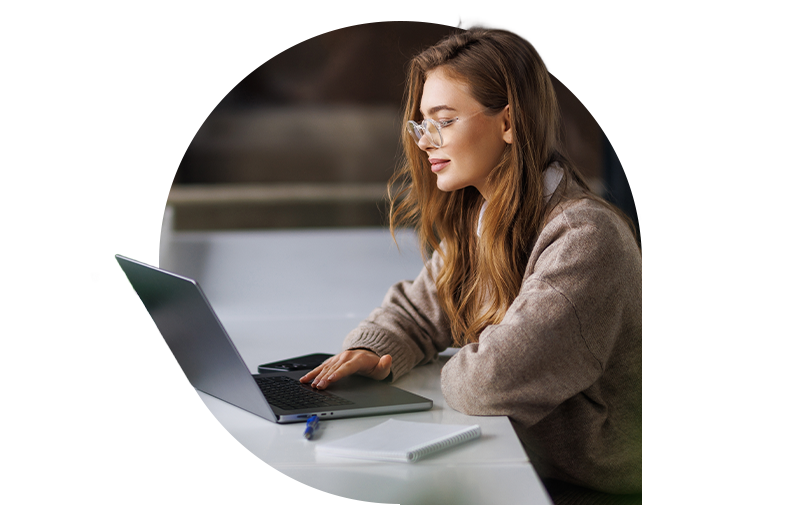 Woman working on laptop in a modern office
