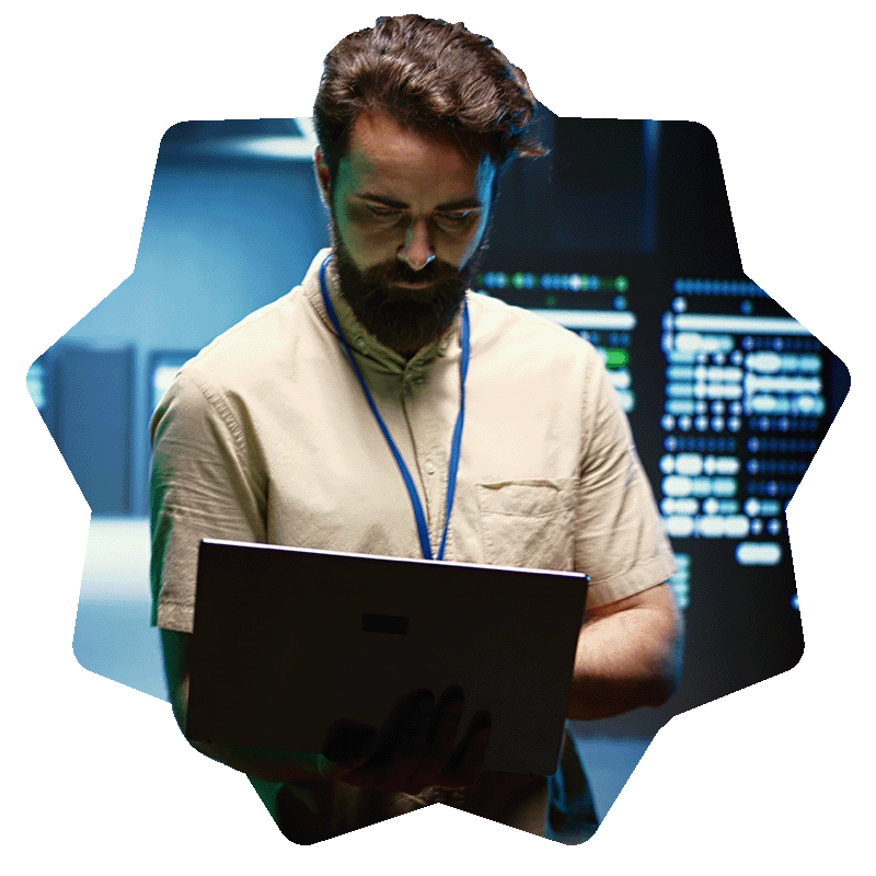 IT Engineer standing holding a latpop