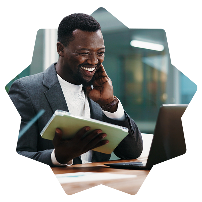 Happy man holding a tablet