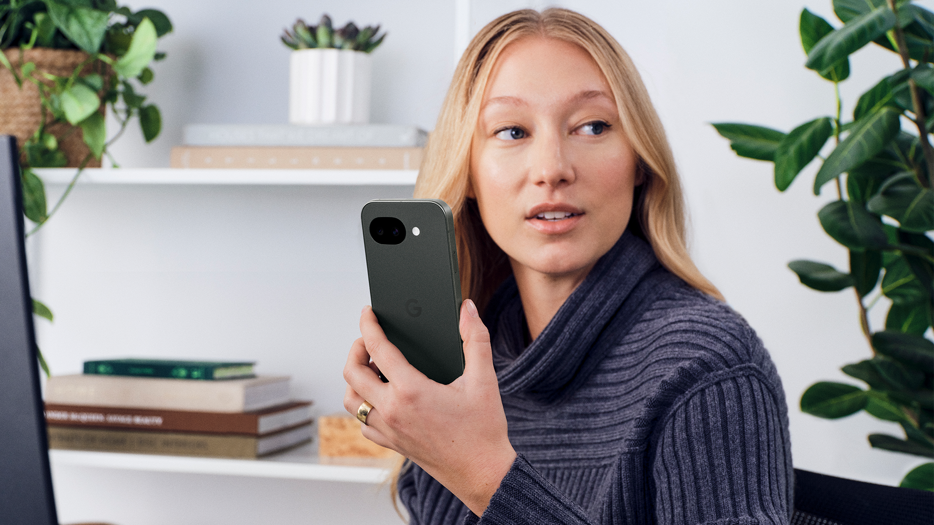 Business professional holding a Google Pixel device