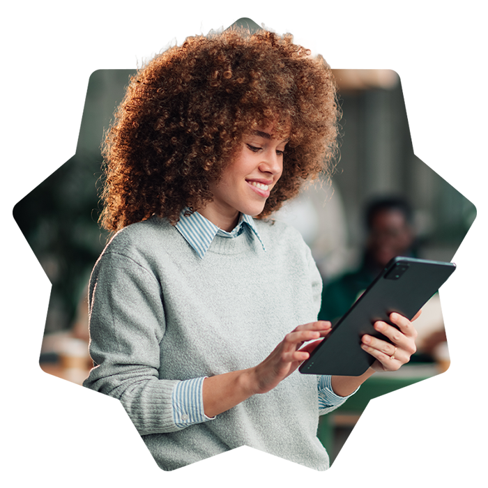 Young smiling woman using a tablet
