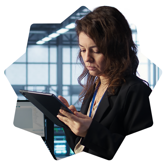 Woman standing in office using tablet