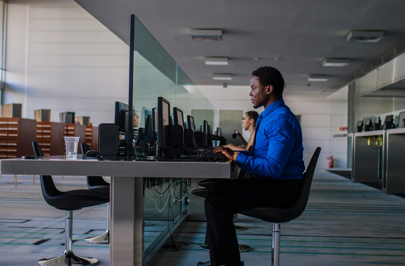 Man using laptop in quiet office
