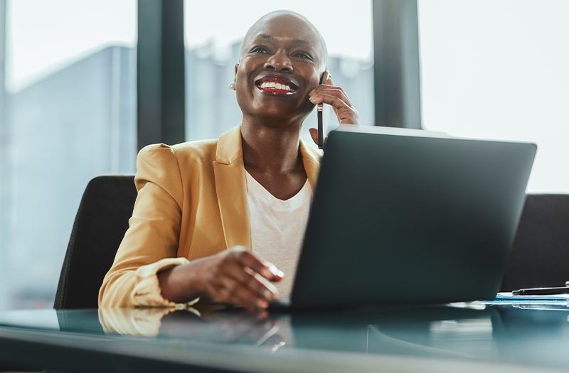 Woman using laptop in a modern office