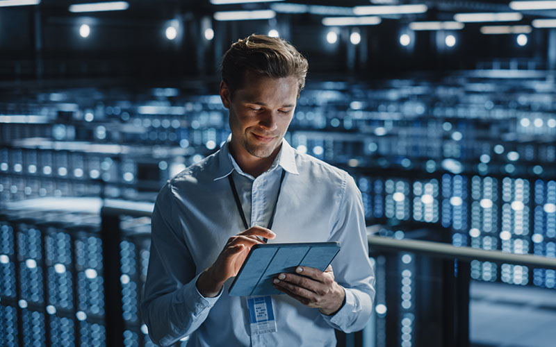 Man using a tablet in a data room