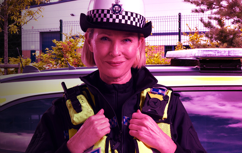 Police officer in front of car