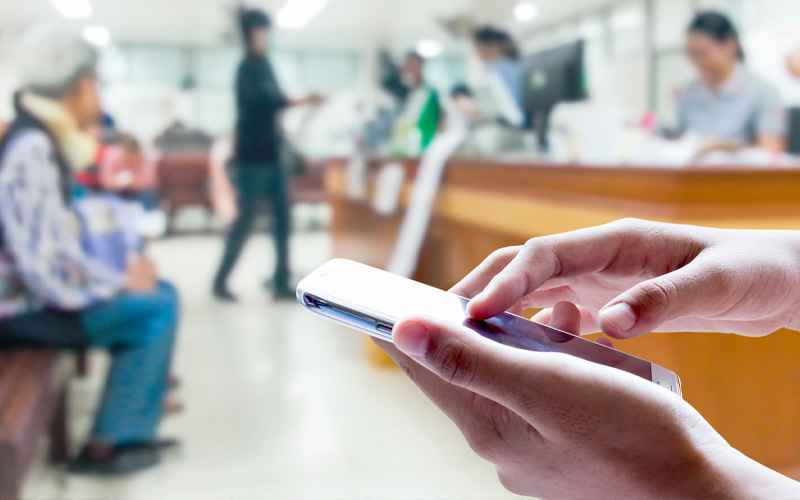 Someone using smartphone in a waiting room