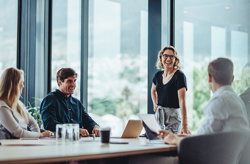 Business professionals joyful in a meeting