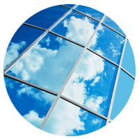 Clouds reflected in windows of modern business building 