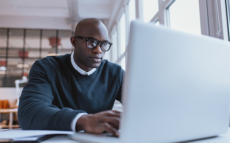 Man using a laptop at work