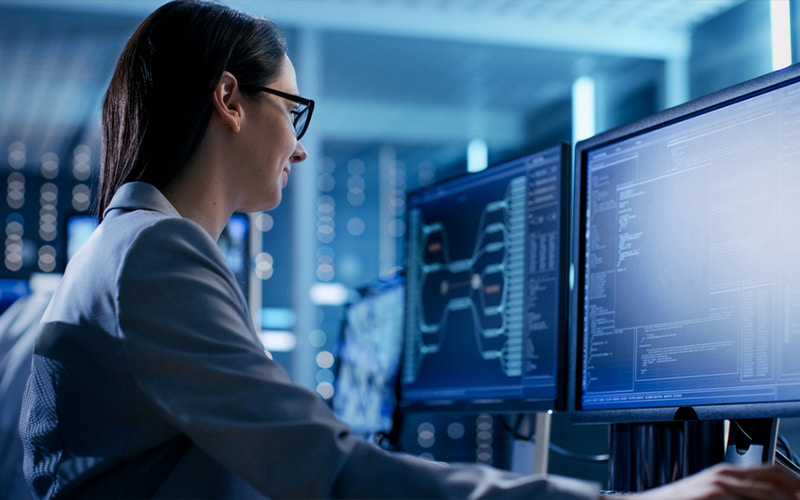 Woman assessing a data centre