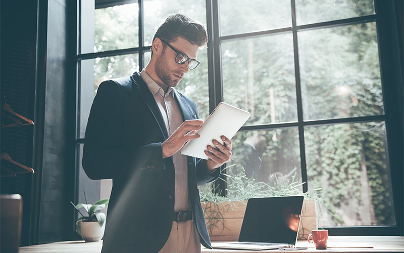 Man using a tablet to access the cloud.