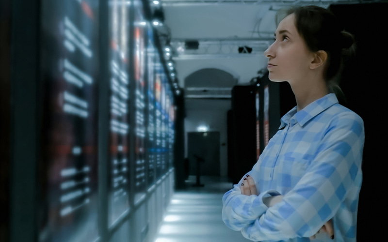 Woman assessing a data centre