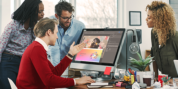 Business professionals working with the Creative Cloud Suite