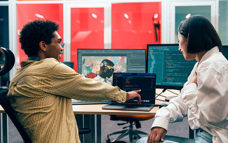 Business professionals working with the Creative Cloud Suite