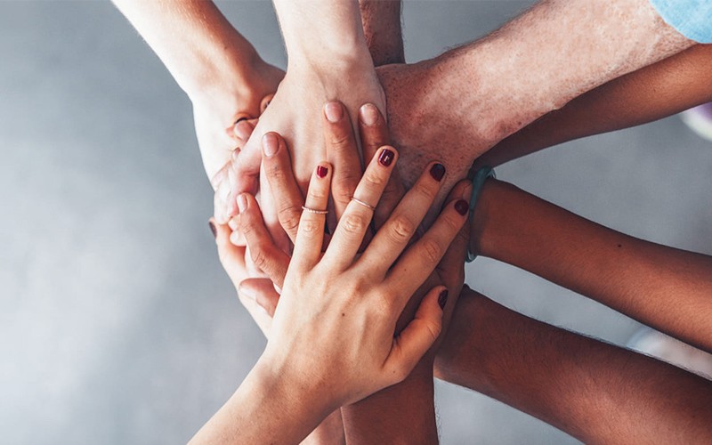 Acer Project Humanity Hands on top of one another