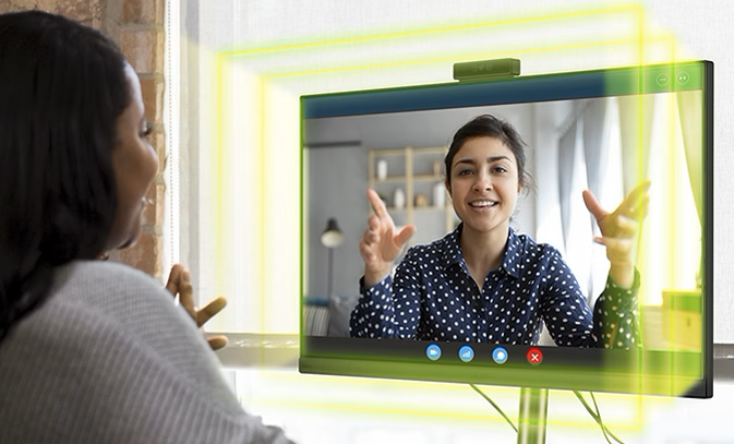 Explore the range of Chromebooks to suit your business Women using Acer Monitor for a video call