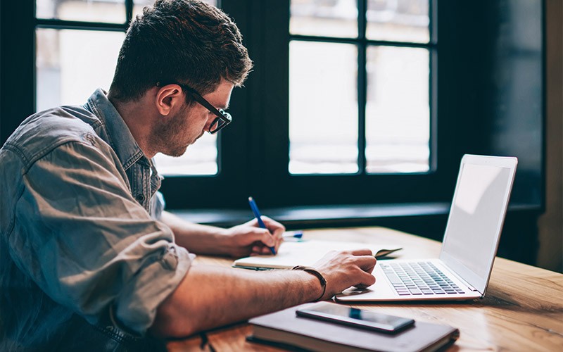 Man working remotely on a laptop