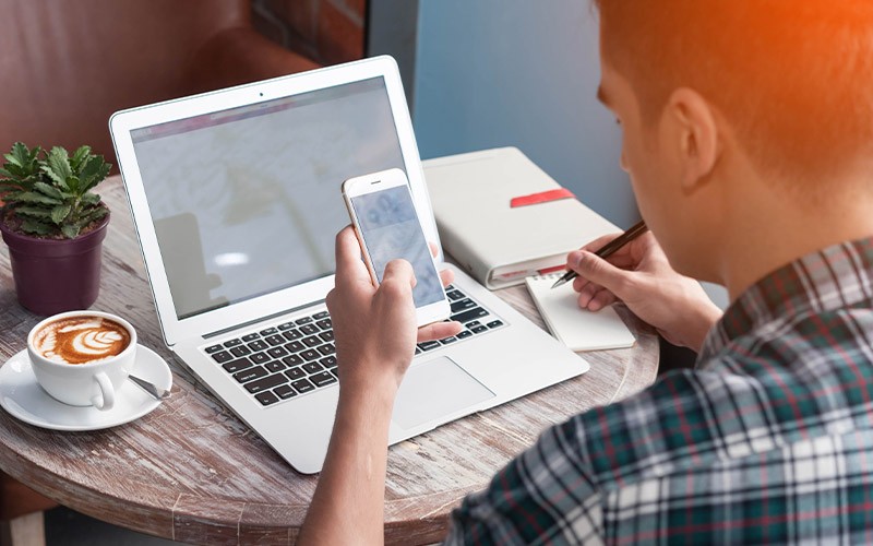 Get a comprehensive assessment Man holding iPhone