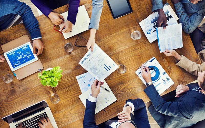 Transformation is not a future activity, it is a present event. Group of business people during a meeting