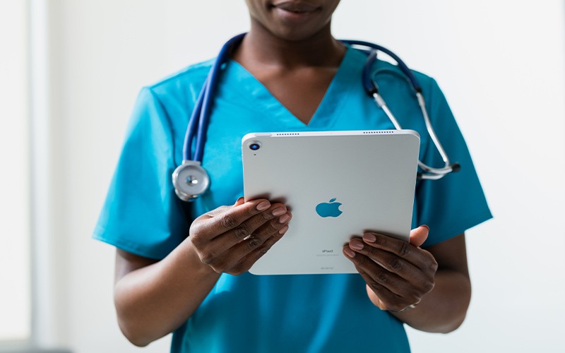 Apple products in healthcare Doctor with x-rays on iPad