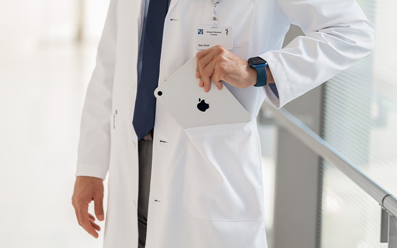 Transform the way in which you deliver your healthcare services Doctor holding iPad