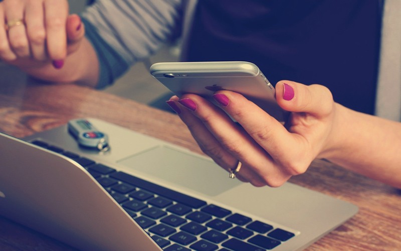 Woman working on apple devices