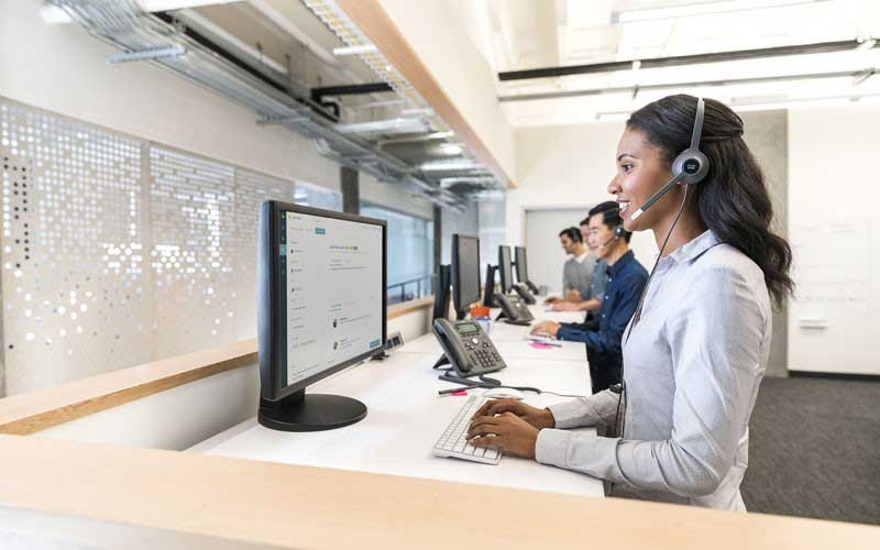 Cisco woman using Cisco headset lifestyle