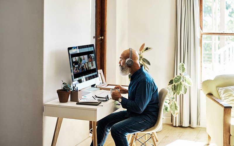 Supporting end-to-end connections Man with headphones on working from home
