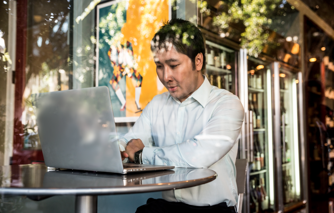 man at desk with laptop