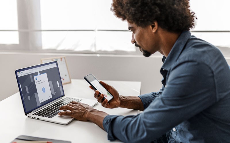 Cisco Duo prevents unauthorised access for organisations Businessman using Cisco Duo security solutions on his devices