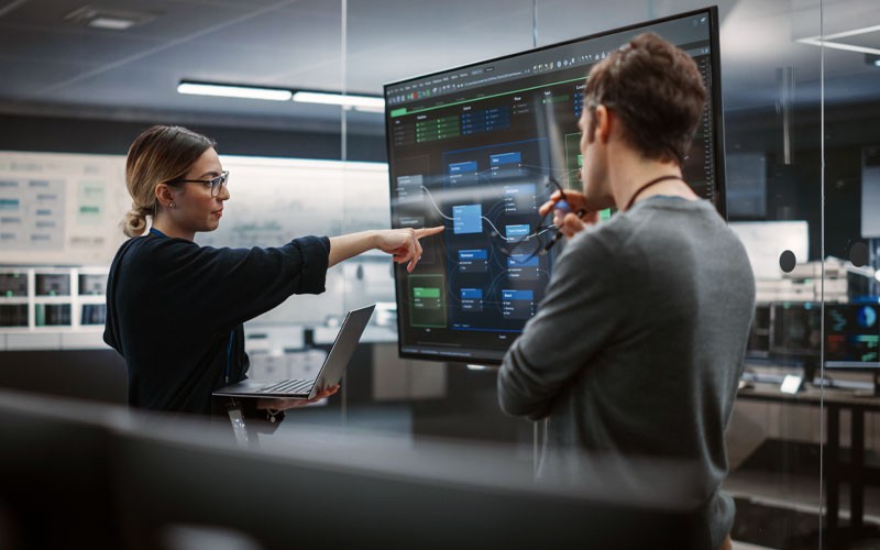 IT professionals collaborating on security plans in office