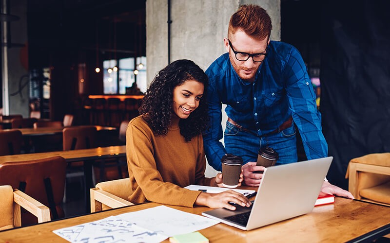 Businessman and businesswoman working together