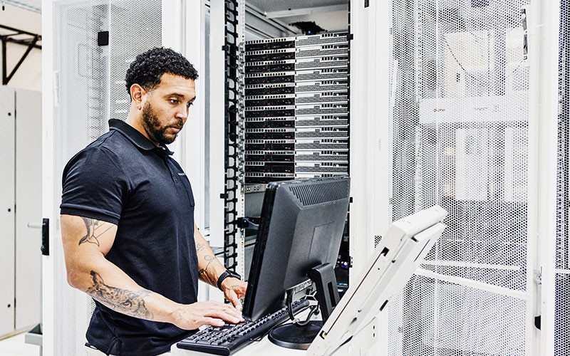 Cisco infrastructure Man working in data centre