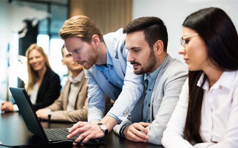 Desktop virtualisation Business meeting setting up laptop device