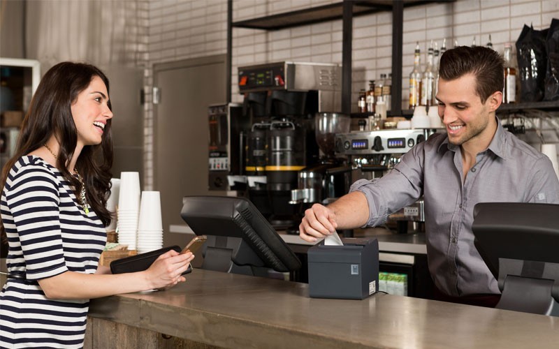 Epson commercial printing solutions Coffee shop employee printing receipt on Epson printer