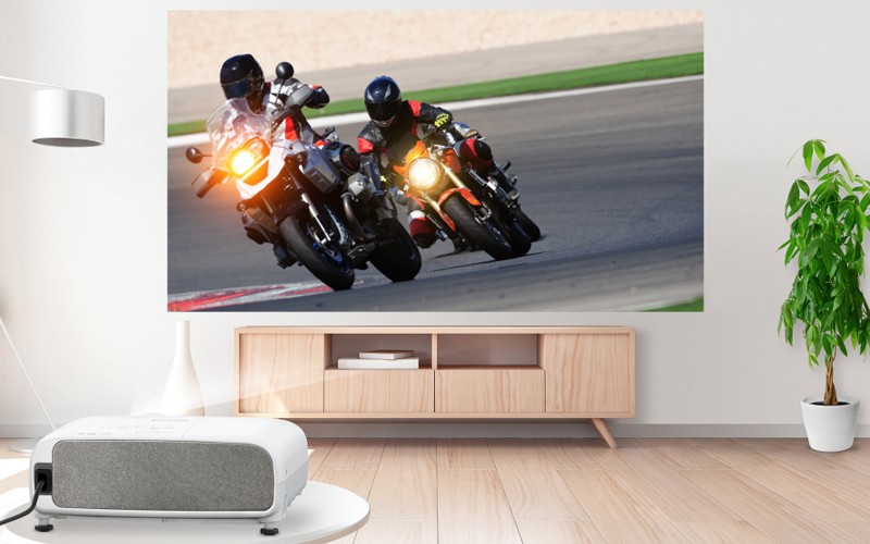 Epson projectors enhance communication and inspire collaboration Woman working at standing table with Epson projector