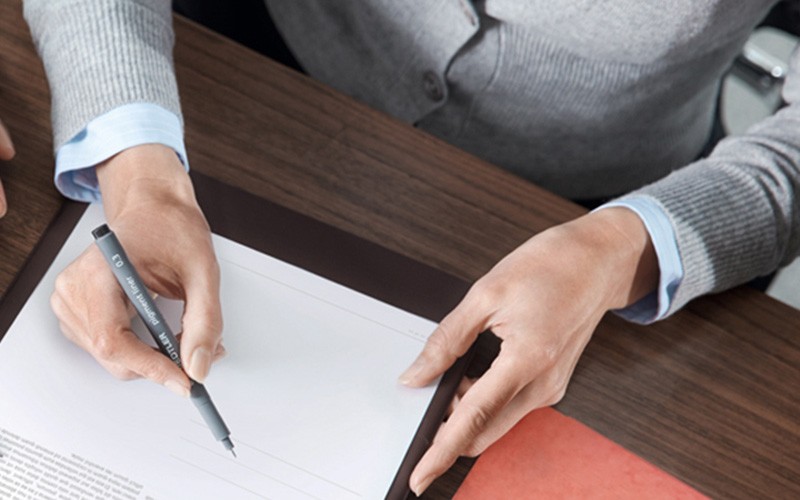 Scanner that change to the needs of your business Someone signing a digital document