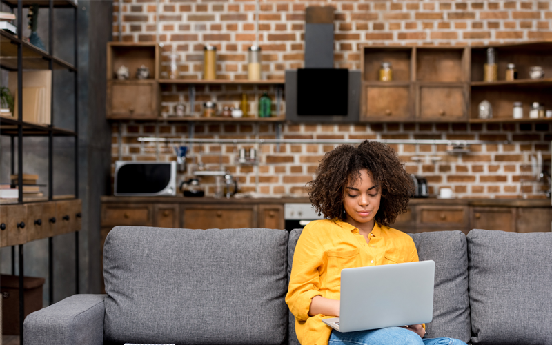 Woman with laptop at home
