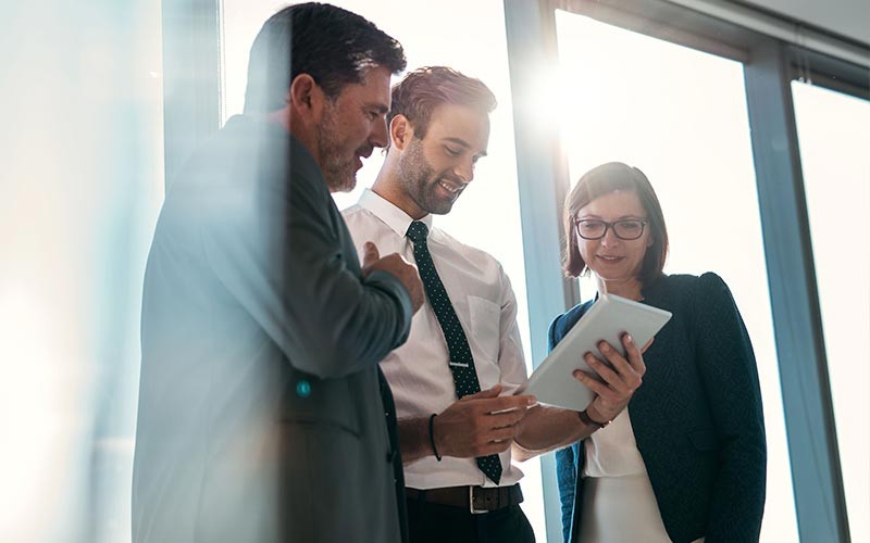 Woman and male discussing over desktop device