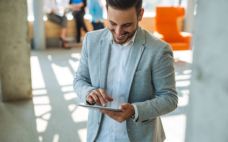 Hands-on evaluation and testing of HPE Nimble Storage Man smiling using a tablet