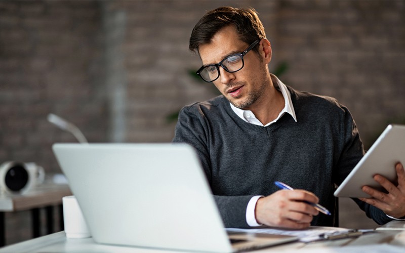 Man working at laptop Man working at laptop