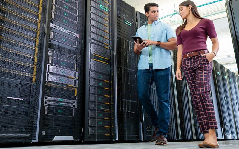 HPE Pointnext is a full suite of consulting services Two employees walking through server room