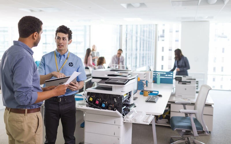 Printer technician checking the HP Color LaserJet Enterprise Flow MFP M577z