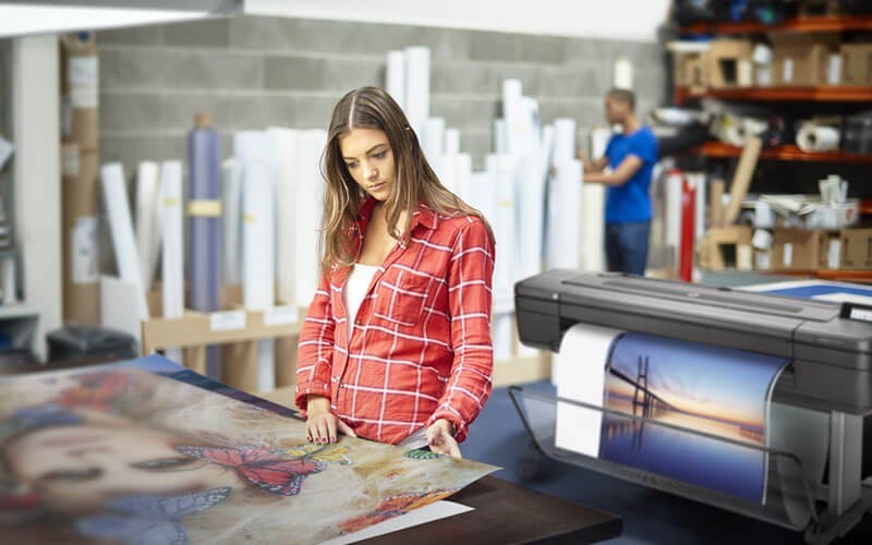 HP woman printing off DesignJet